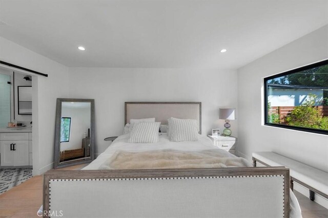 1834 Stearns Dr, Los Angeles, CA 90035 - bedroom featuring wood finished floors, recessed lighting, and a barn door