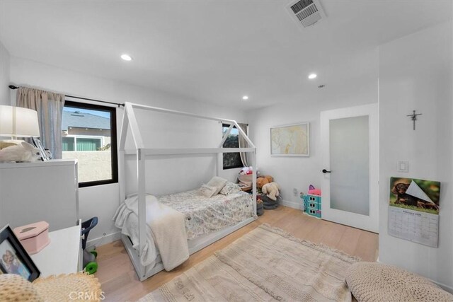 1834 Stearns Dr, Los Angeles, CA 90035 - bedroom featuring wood finished floors, multiple windows, and recessed lighting