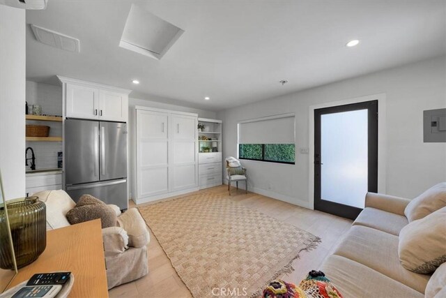 1834 Stearns Dr, Los Angeles, CA 90035 - living area featuring attic access, electric panel, recessed lighting, and light wood finished floors