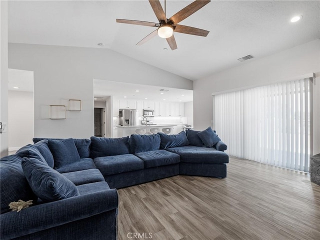 15679 Tuscola Rd, Apple Valley, CA 92307 - living area with ceiling fan, lofted ceiling, and light wood-style floors
