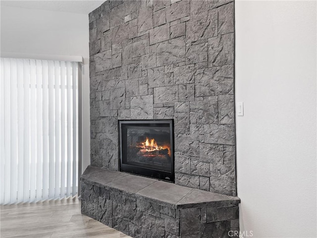 15679 Tuscola Rd, Apple Valley, CA 92307 - detailed view of a stone fireplace and wood finished floors