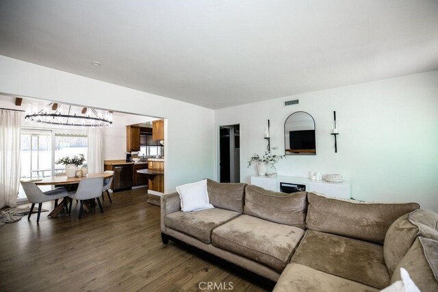 27820 Ferguson Dr, Castaic, CA 91384 - living room with wood finished floors and a chandelier