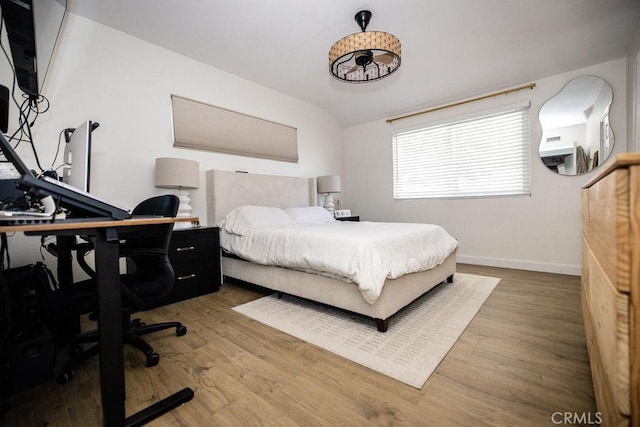 27820 Ferguson Dr, Castaic, CA 91384 - bedroom with wood finished floors, a desk, and vaulted ceiling