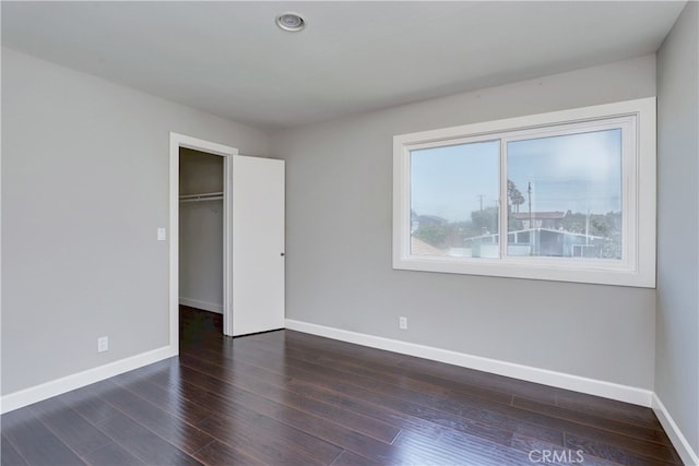 6804 Elm, Cypress, CA 90630 - unfurnished bedroom with dark wood-style flooring, a walk in closet, and a closet