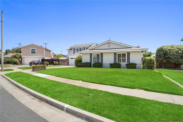 16660 Spruce Cir, Fountain Valley, CA 92708 - view of front facade featuring a garage and concrete driveway