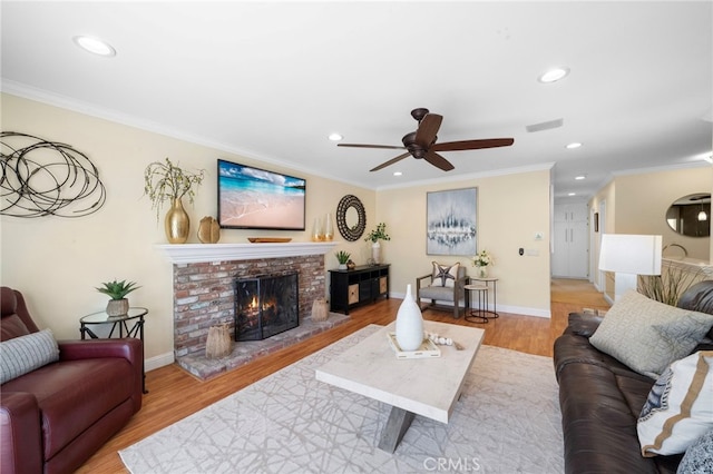 16660 Spruce Cir, Fountain Valley, CA 92708 - living room featuring a fireplace, ceiling fan, crown molding, recessed lighting, and wood finished floors