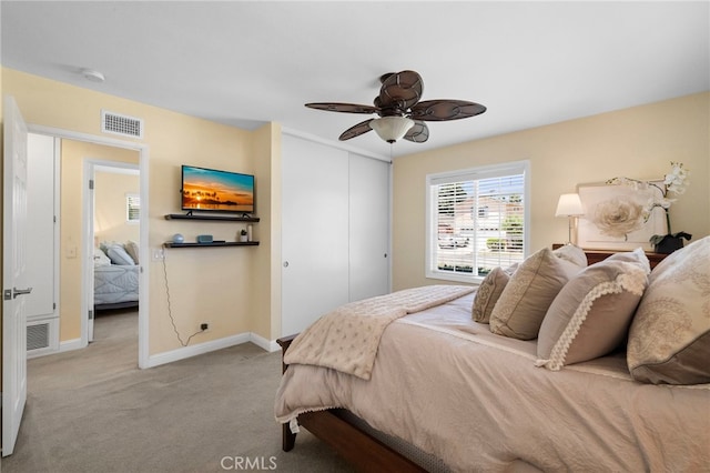16660 Spruce Cir, Fountain Valley, CA 92708 - bedroom with a closet, light colored carpet, and ceiling fan