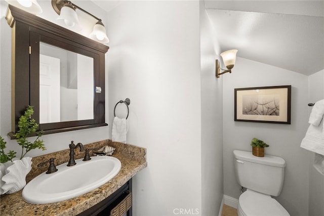 16660 Spruce Cir, Fountain Valley, CA 92708 - half bathroom with vanity and vaulted ceiling