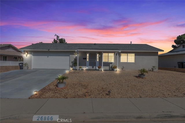 26866 Oakmont Dr, Menifee, CA 92586 - ranch-style home with an attached garage, concrete driveway, and stucco siding