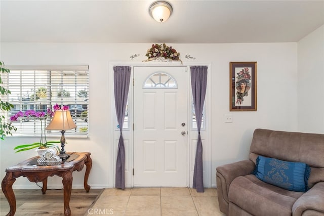 26866 Oakmont Dr, Menifee, CA 92586 - entrance foyer with baseboards and light tile patterned floors