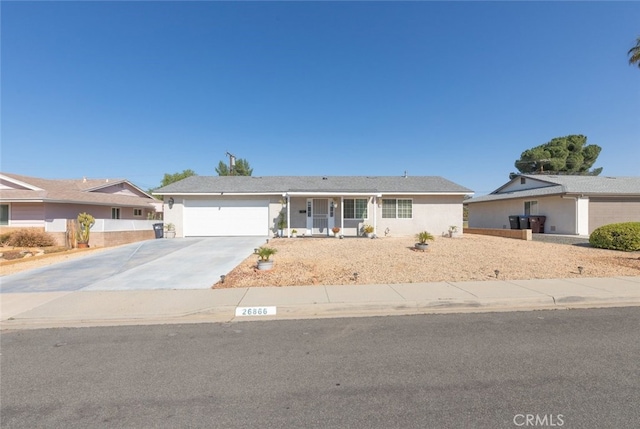 26866 Oakmont Dr, Menifee, CA 92586 - ranch-style home with an attached garage, concrete driveway, and stucco siding