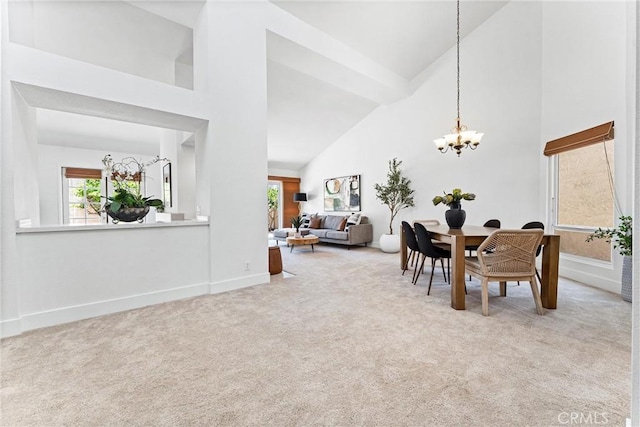 28082 Palmetto Ct, Laguna Niguel, CA 92677 - carpeted dining area featuring high vaulted ceiling and a chandelier