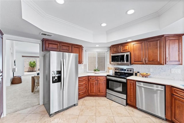 28082 Palmetto Ct, Laguna Niguel, CA 92677 - kitchen featuring appliances with stainless steel finishes, recessed lighting, a raised ceiling, light countertops, and light tile patterned floors