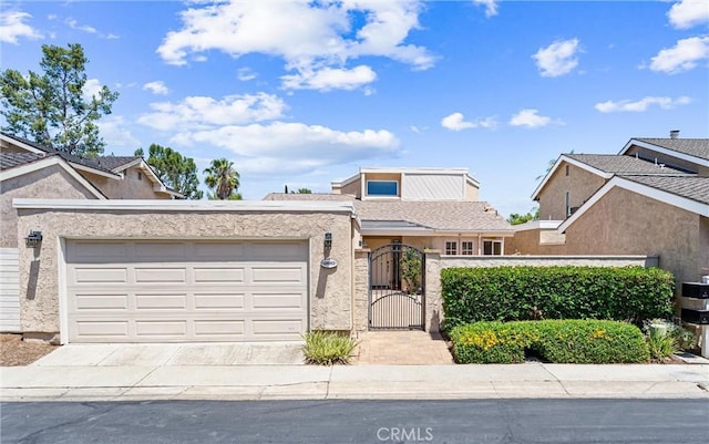 28082 Palmetto Ct, Laguna Niguel, CA 92677 - view of front facade featuring a garage, a gate, driveway, a fenced front yard, and stucco siding