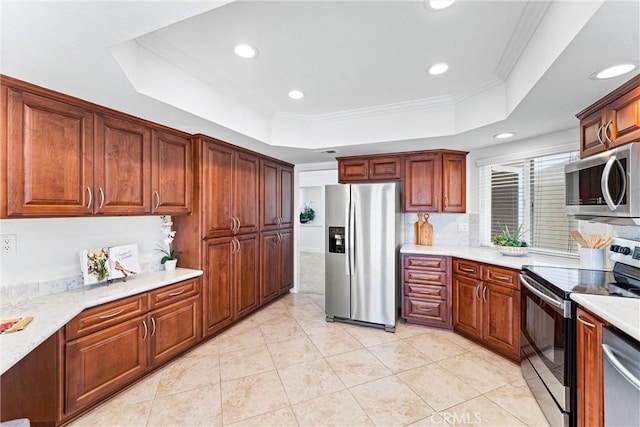 28082 Palmetto Ct, Laguna Niguel, CA 92677 - kitchen featuring stainless steel appliances, a raised ceiling, recessed lighting, light countertops, and light tile patterned floors