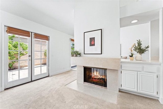 28082 Palmetto Ct, Laguna Niguel, CA 92677 - unfurnished living room featuring light carpet, a tile fireplace, and french doors