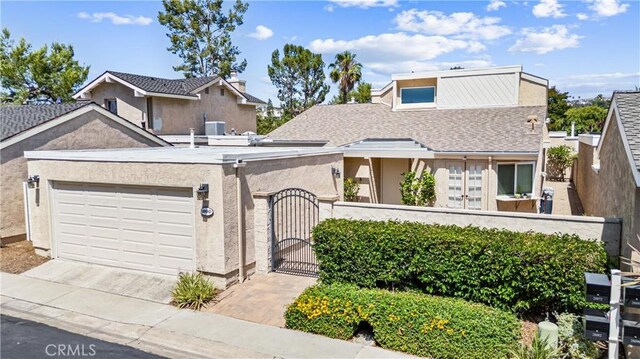 28082 Palmetto Ct, Laguna Niguel, CA 92677 - view of front of home with a gate, driveway, an attached garage, and stucco siding