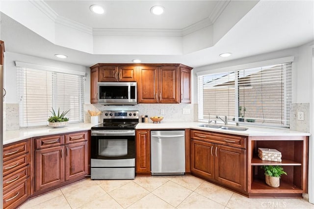 28082 Palmetto Ct, Laguna Niguel, CA 92677 - kitchen with appliances with stainless steel finishes, tasteful backsplash, light countertops, crown molding, and a tray ceiling