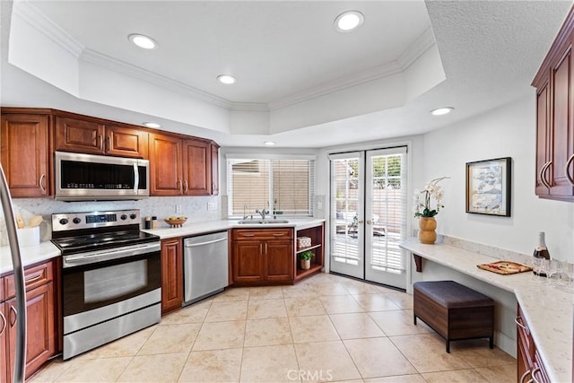 28082 Palmetto Ct, Laguna Niguel, CA 92677 - kitchen with stainless steel appliances, crown molding, recessed lighting, a tray ceiling, and french doors
