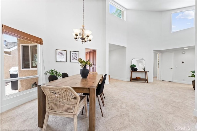 28082 Palmetto Ct, Laguna Niguel, CA 92677 - dining area with a chandelier, a high ceiling, and light colored carpet