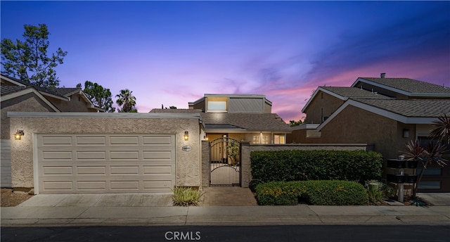 28082 Palmetto Ct, Laguna Niguel, CA 92677 - view of front of property with driveway, an attached garage, a gate, and stucco siding