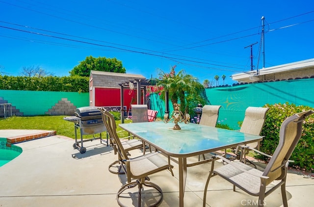 20606 Skouras Dr, Winnetka, CA 91306 - view of patio / terrace with a storage unit, outdoor dining space, and area for grilling