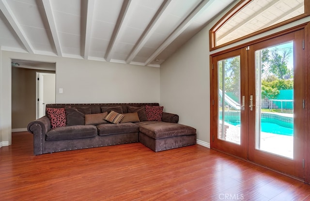 20606 Skouras Dr, Winnetka, CA 91306 - living area featuring french doors, wood finished floors, and vaulted ceiling