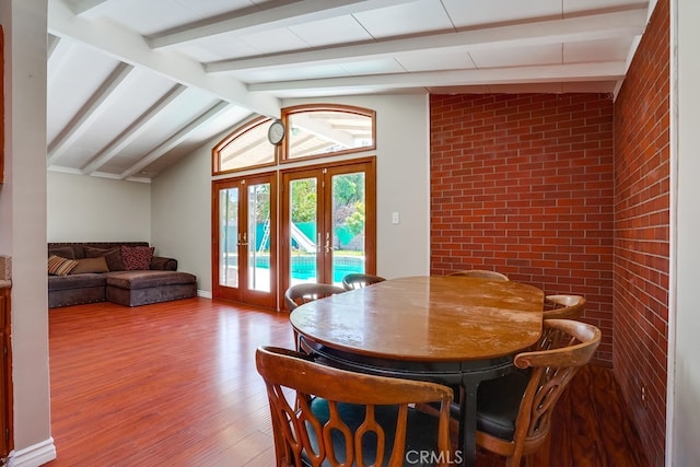 20606 Skouras Dr, Winnetka, CA 91306 - dining room with wood finished floors, brick wall, and french doors
