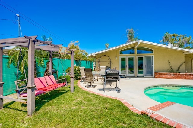 20606 Skouras Dr, Winnetka, CA 91306 - back of property with stucco siding, french doors, a patio, a fenced backyard, and a pergola