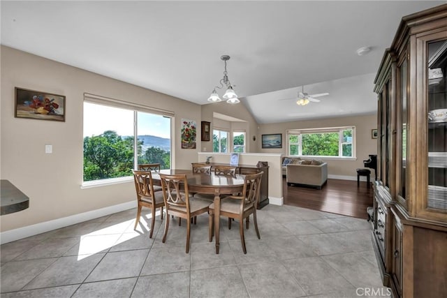19040 Redbud Rd, Hidden Valley Lake, CA 95467 - dining area with light tile patterned floors, ceiling fan, and vaulted ceiling