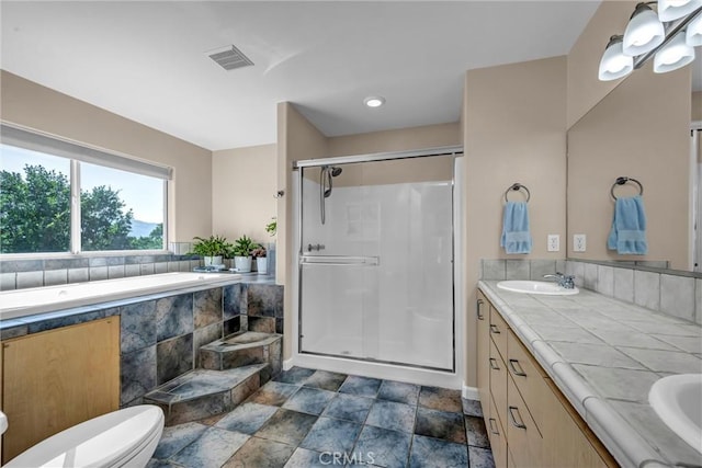 19040 Redbud Rd, Hidden Valley Lake, CA 95467 - bathroom with a stall shower, double vanity, a garden tub, and stone finish flooring