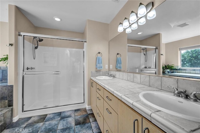 19040 Redbud Rd, Hidden Valley Lake, CA 95467 - bathroom featuring a stall shower, double vanity, stone finish floors, and a bath