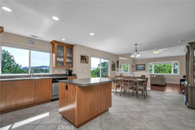 19040 Redbud Rd, Hidden Valley Lake, CA 95467 - kitchen with dishwasher, a kitchen island, glass insert cabinets, a ceiling fan, and recessed lighting