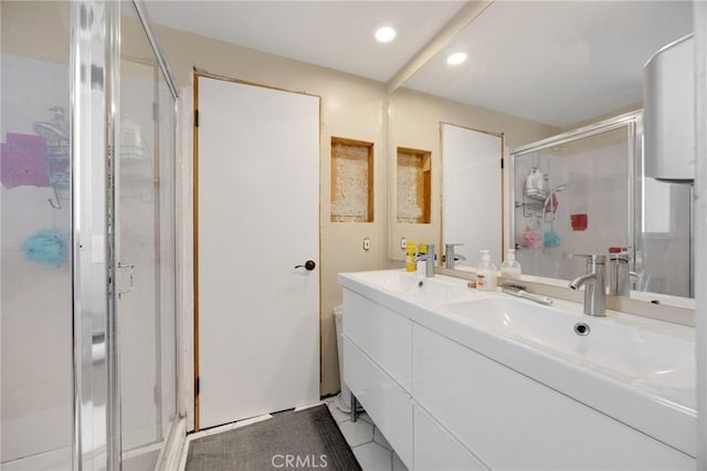 1411 Woodcrest Ave, La Habra, CA 90631 - bathroom featuring a shower stall, double vanity, and recessed lighting