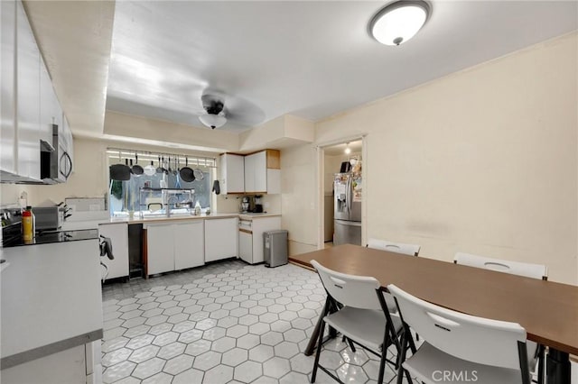 1411 Woodcrest Ave, La Habra, CA 90631 - kitchen with appliances with stainless steel finishes and white cabinetry