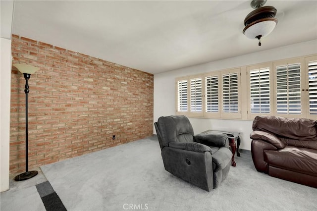 1411 Woodcrest Ave, La Habra, CA 90631 - carpeted living area with brick wall