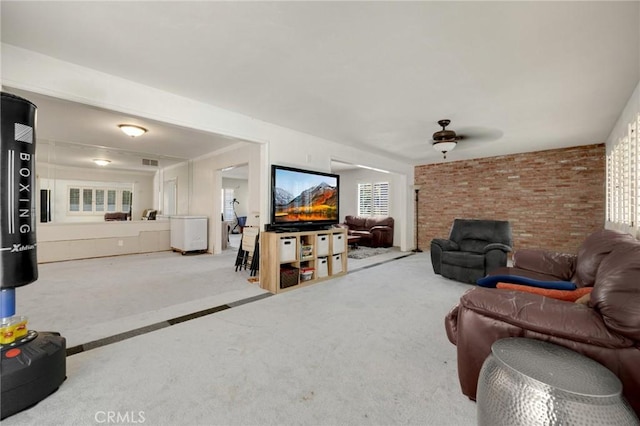 1411 Woodcrest Ave, La Habra, CA 90631 - carpeted living room featuring a ceiling fan and brick wall