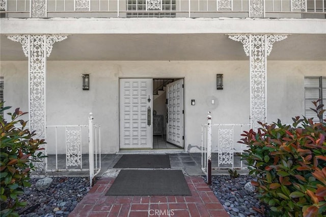 1411 Woodcrest Ave, La Habra, CA 90631 - entrance to property with stucco siding and a porch