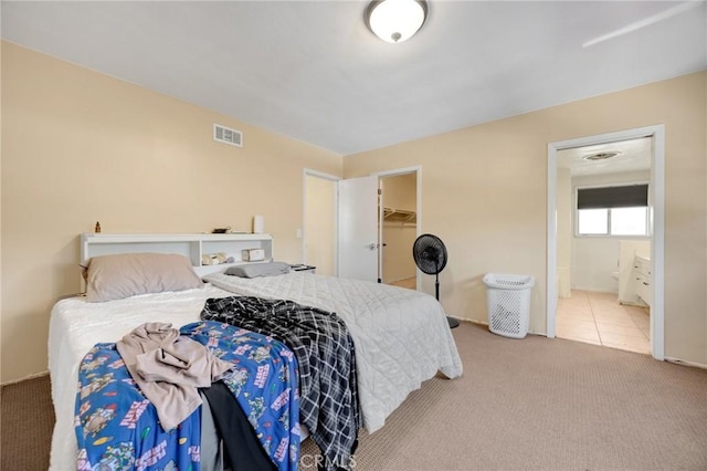 1411 Woodcrest Ave, La Habra, CA 90631 - carpeted bedroom featuring a walk in closet and ensuite bath