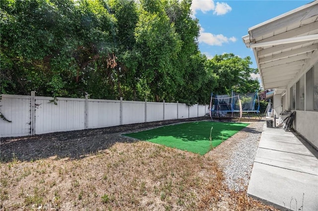 1411 Woodcrest Ave, La Habra, CA 90631 - fenced backyard with a trampoline