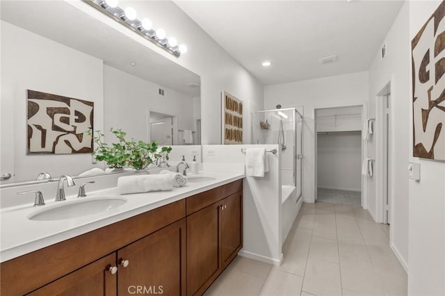 13028 Central Ave Unit 202, Hawthorne, CA 90250 - full bathroom with a shower with door, double vanity, tile patterned floors, a spacious closet, and a bathtub
