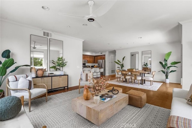 13028 Central Ave Unit 202, Hawthorne, CA 90250 - living room with light wood-style flooring, ceiling fan, recessed lighting, and crown molding