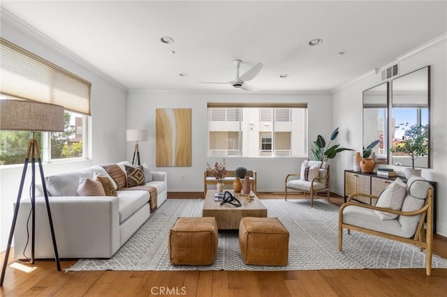 13028 Central Ave Unit 202, Hawthorne, CA 90250 - living room with ornamental molding, healthy amount of natural light, wood finished floors, and ceiling fan