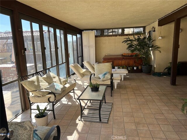 9535 Timberlane Ave, Hesperia, CA 92345 - sunroom / solarium with a textured ceiling, an outdoor hangout area, tile patterned floors, and a hot tub