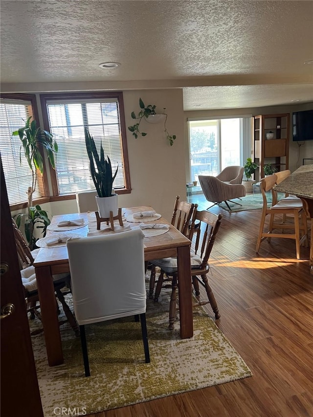 9535 Timberlane Ave, Hesperia, CA 92345 - dining space featuring a textured ceiling and wood finished floors