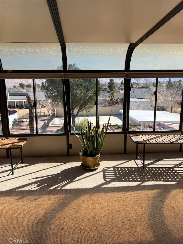 9535 Timberlane Ave, Hesperia, CA 92345 - unfurnished sunroom with plenty of natural light and carpet flooring