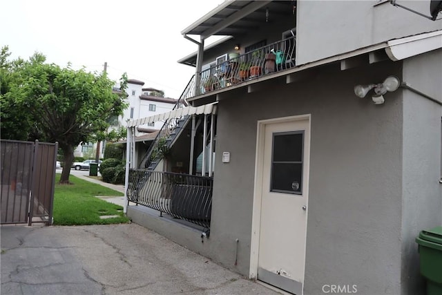 14151 Moorpark St, Sherman Oaks, CA 91423 - view of property exterior featuring stucco siding and a balcony