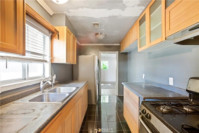 1811 Elaine St, Pomona, CA 91767 - kitchen with gas range, dark tile patterned flooring, glass insert cabinets, freestanding refrigerator, and ornamental molding