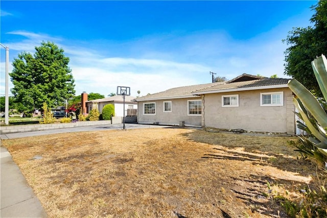 1811 Elaine St, Pomona, CA 91767 - back of house featuring stucco siding and a tiled roof