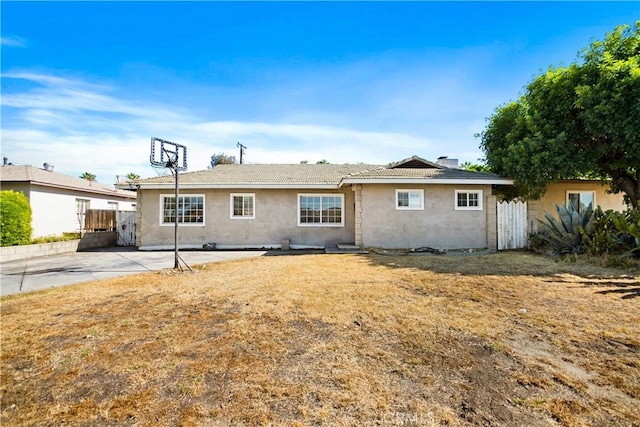 1811 Elaine St, Pomona, CA 91767 - back of property featuring stucco siding, a patio area, and a chimney